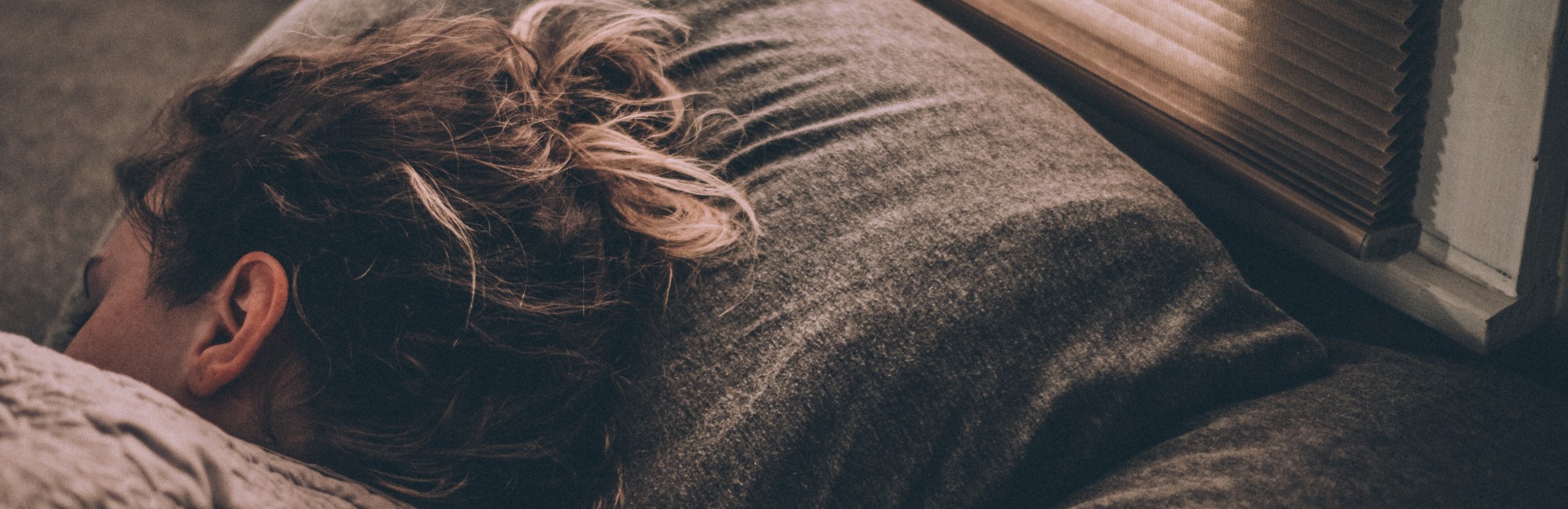 adult woman sleeping on couch