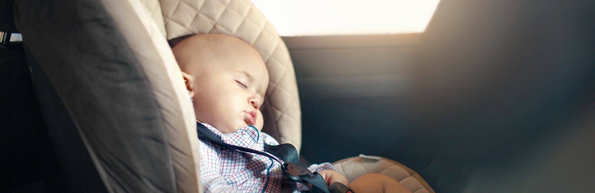 baby napping in carseat during the afternoon
