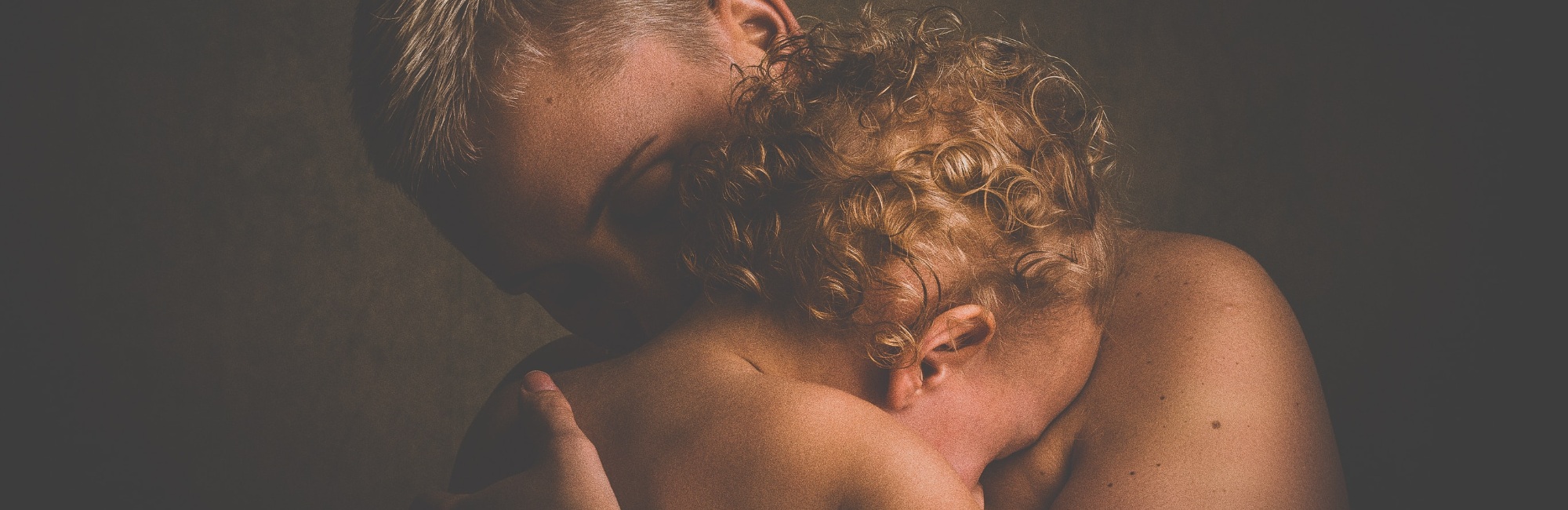 toddler cuddles parent in the night
